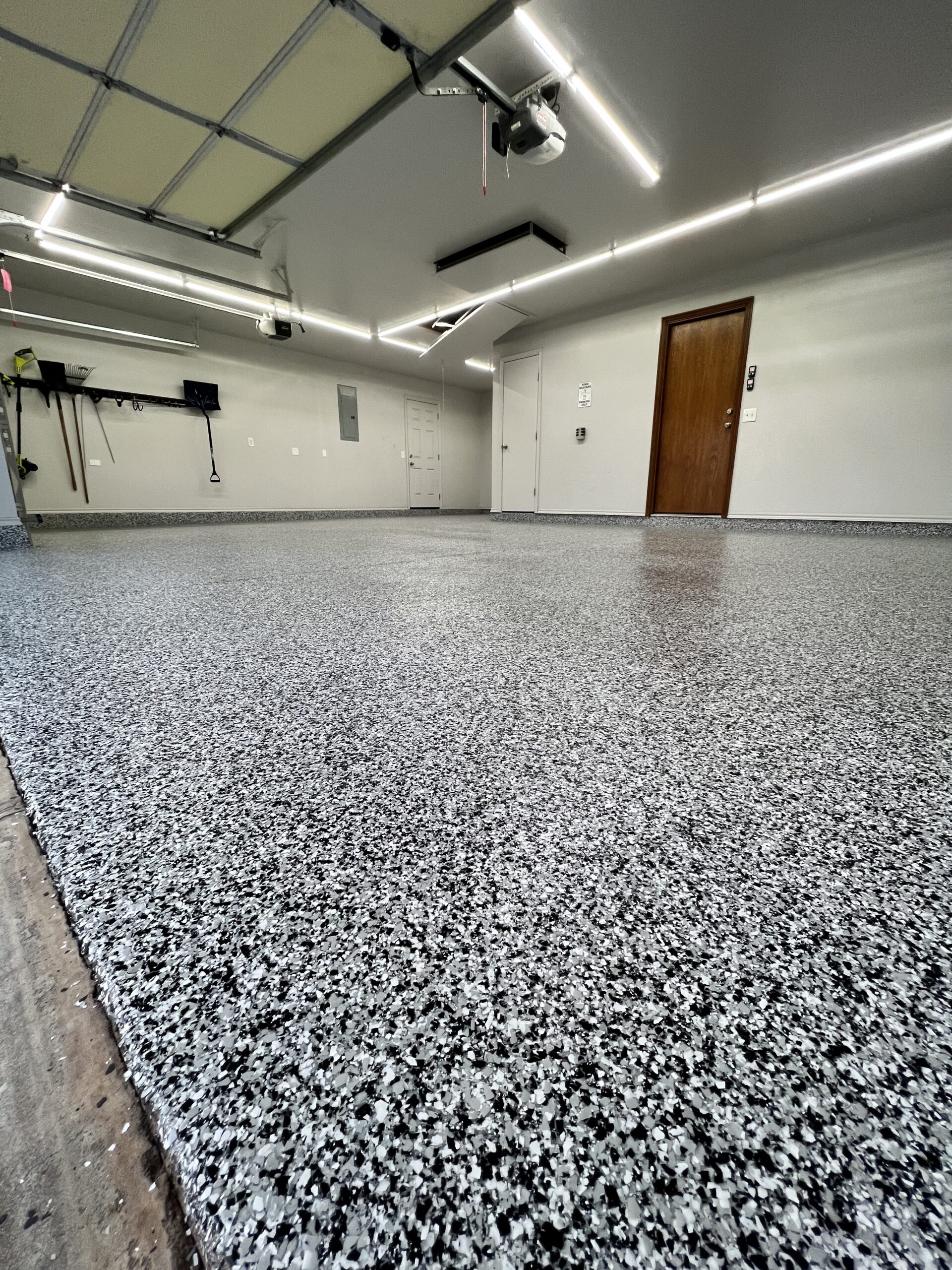 Flake epoxy garage floor coating installed in a residential garage in Kelowna BC