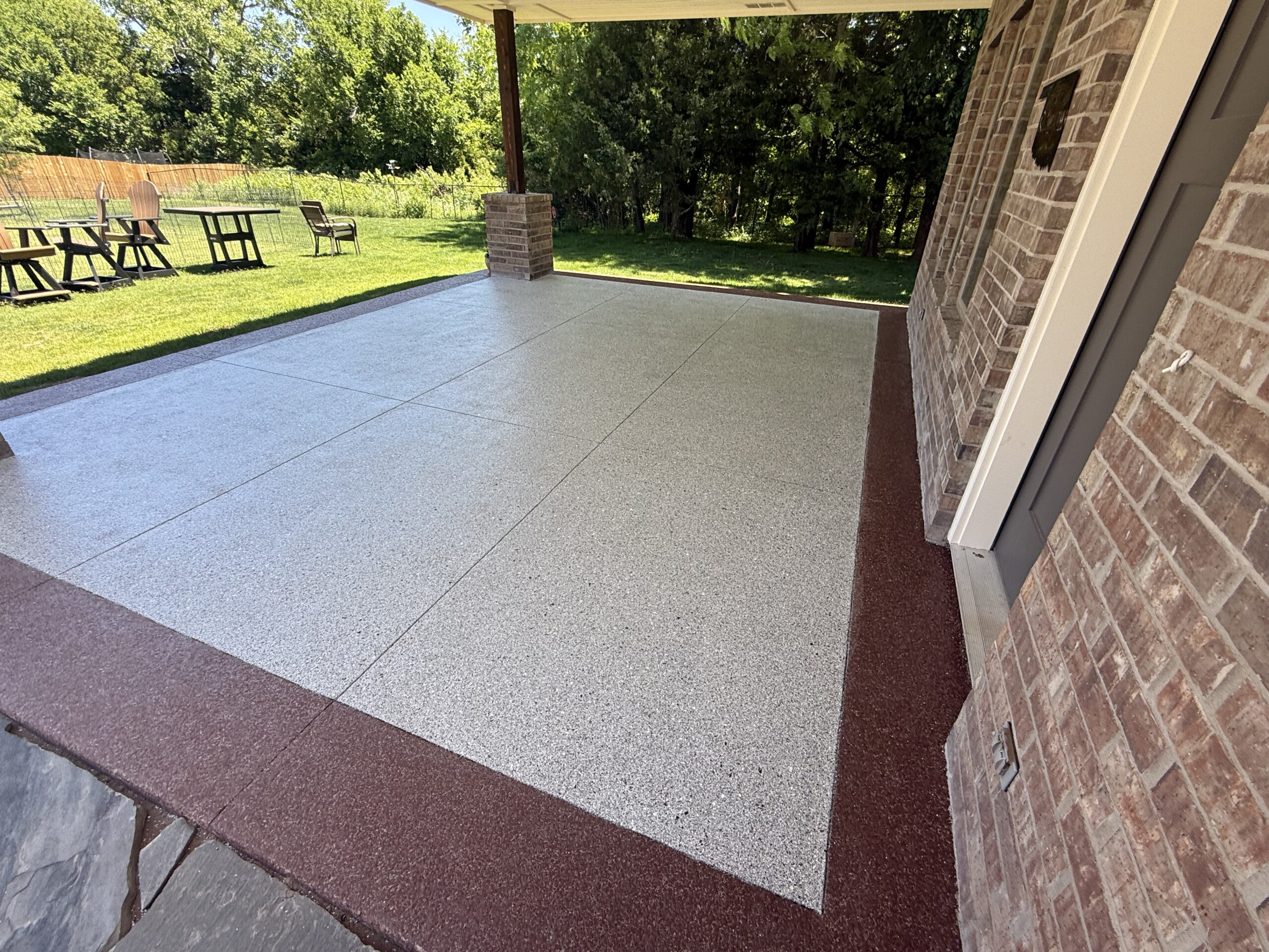 Polyaspartic flake concrete coating on a covered patio in the Okanagan