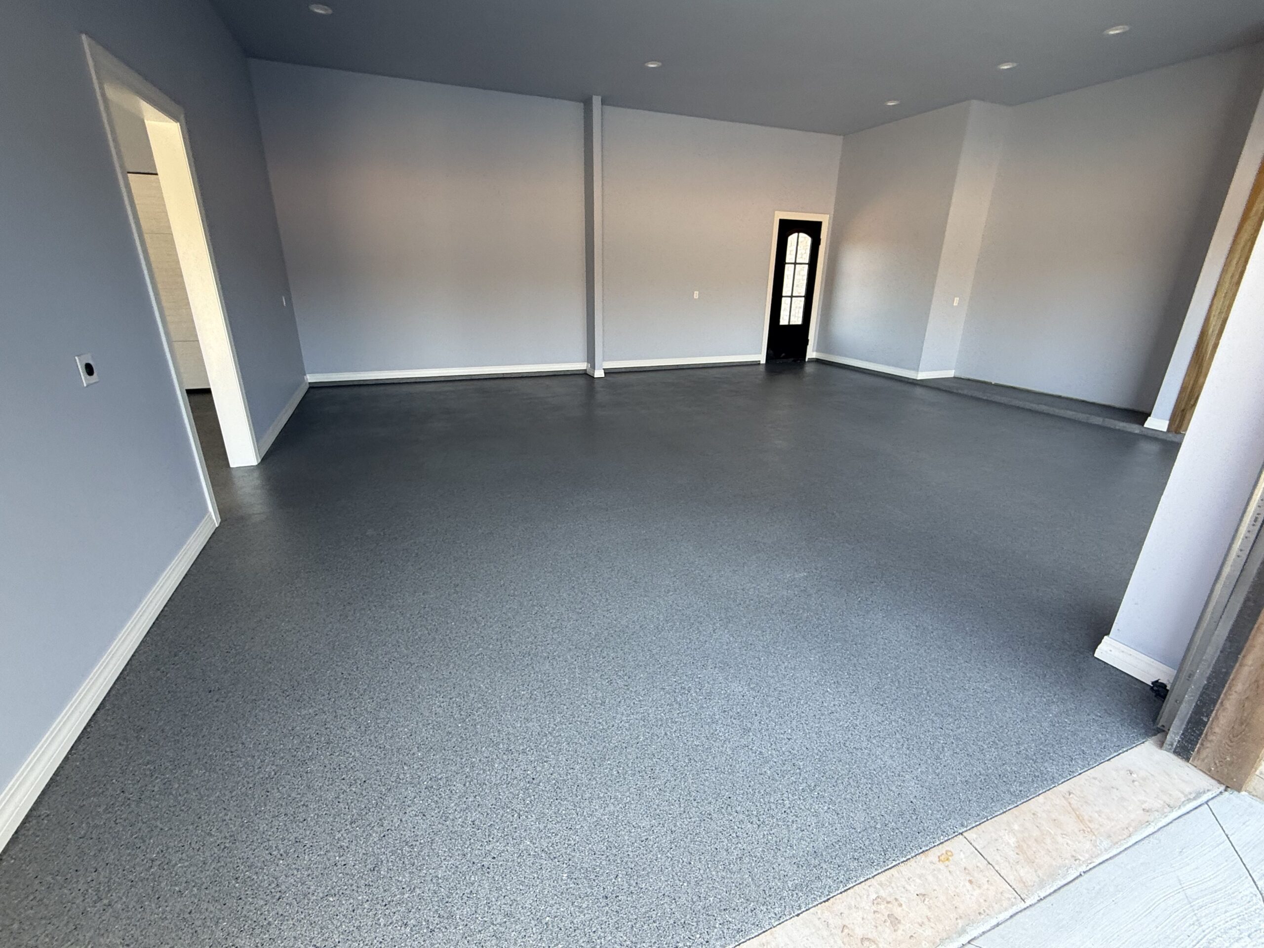 Close-up of flake epoxy garage floor texture and finish