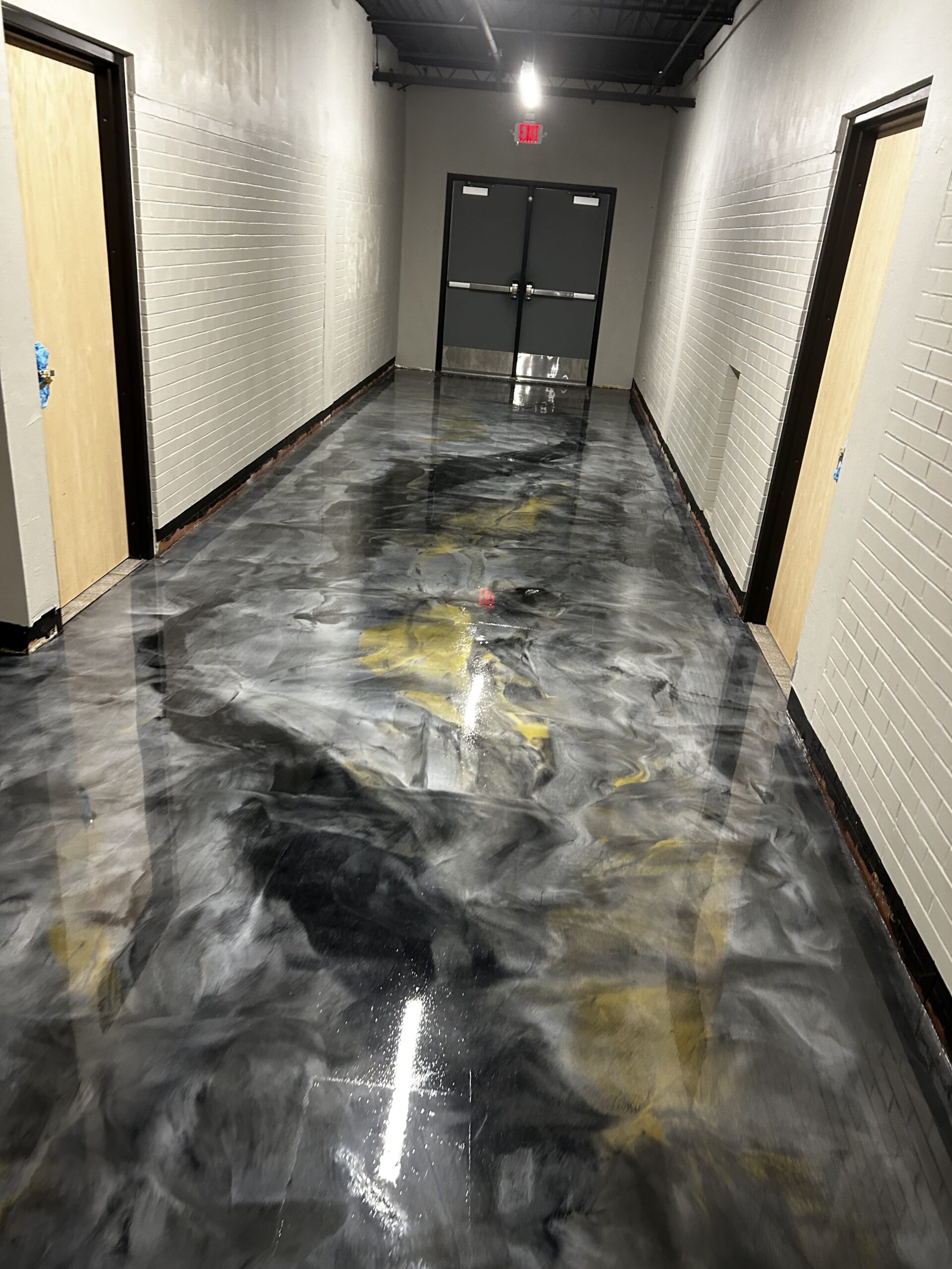 Metallic epoxy floor coating in commercial interior hallway Kelowna BC
