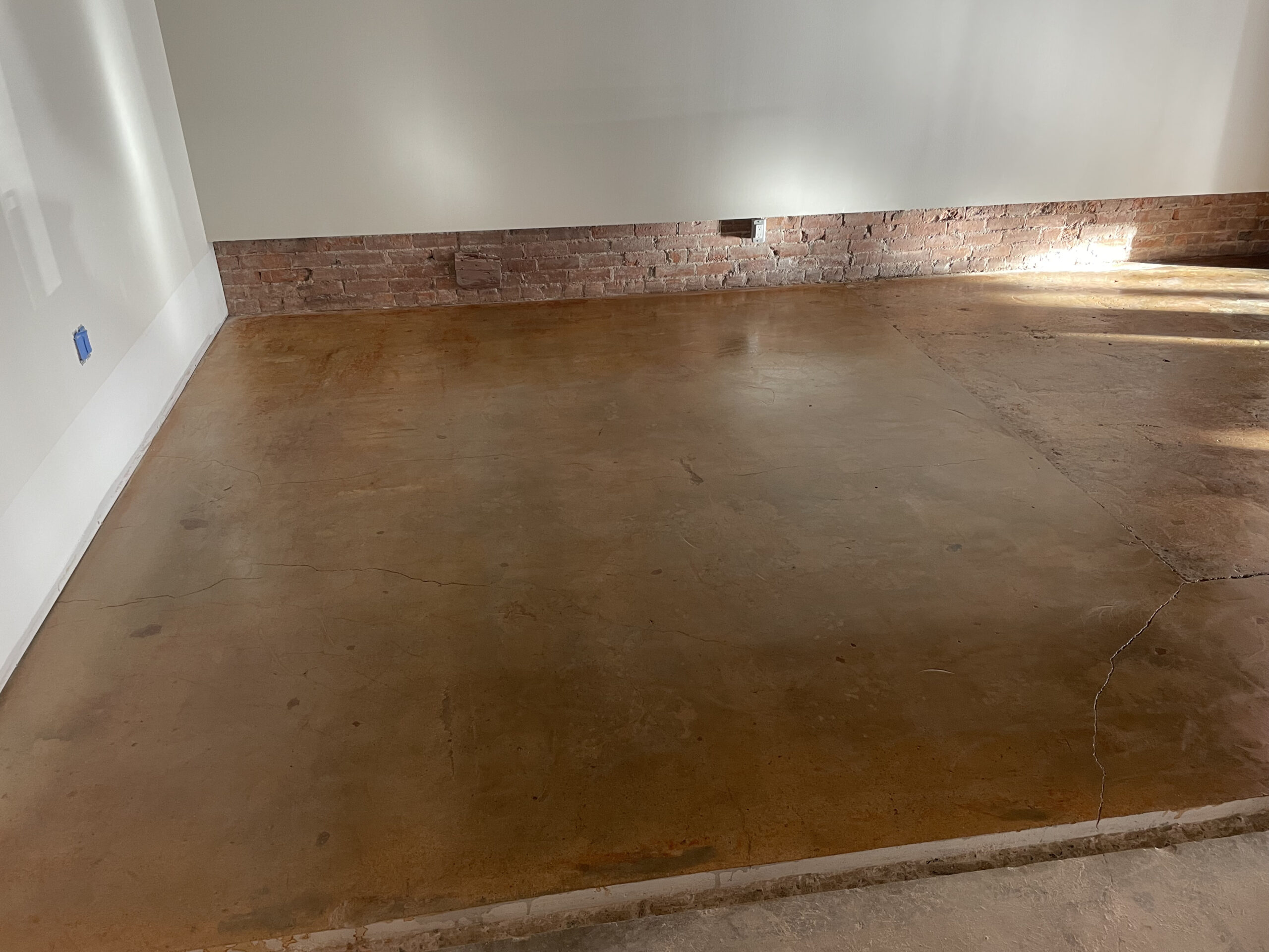 Decorative concrete restoration with recolouring and sealing in Kelowna