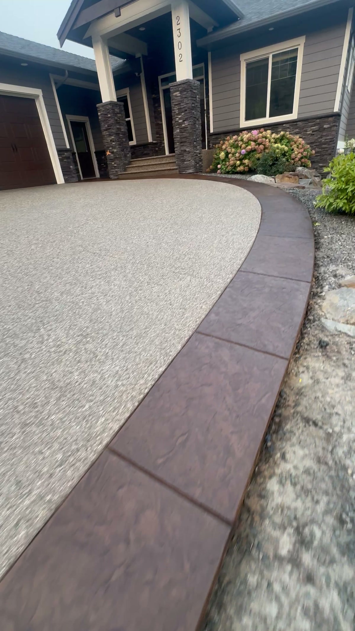 Recoloured stamped driveway border, frame from the completed project video