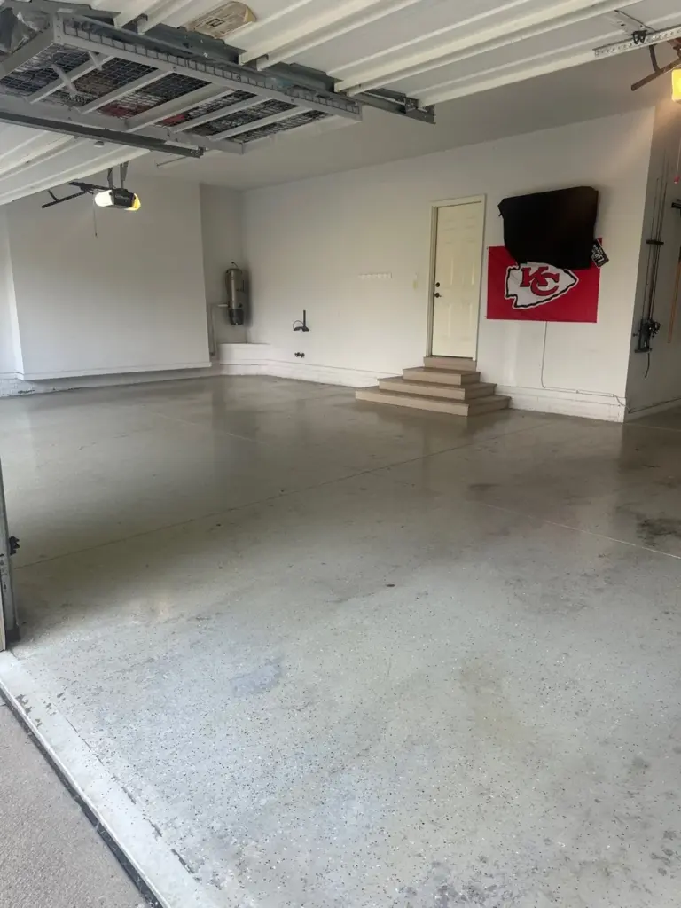 Before the project: IronRock flake coating on a garage floor