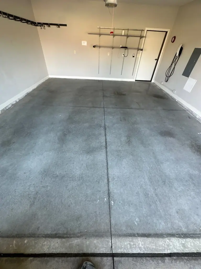 Before the project: IronRock flake coating on a garage floor