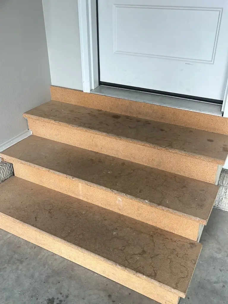 Before the project: IronRock flake coating on exterior concrete
