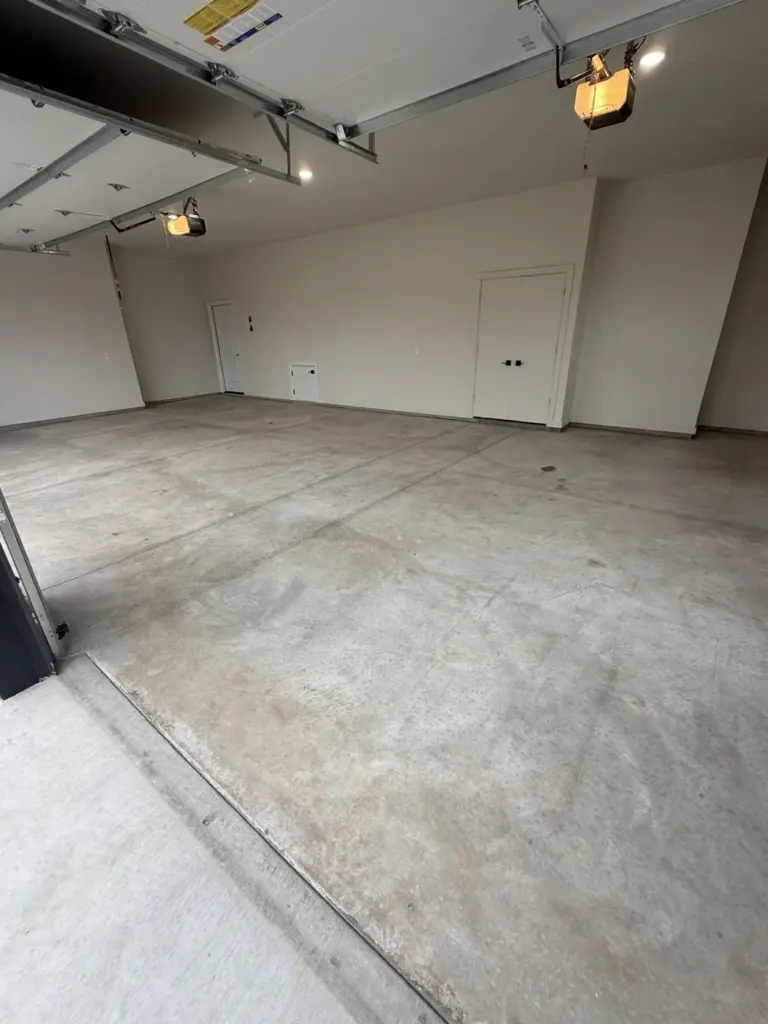Before the project: IronRock flake coating on a garage floor