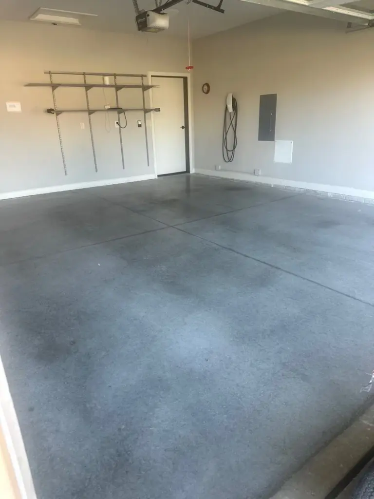 Before the project: IronRock flake coating on a garage floor
