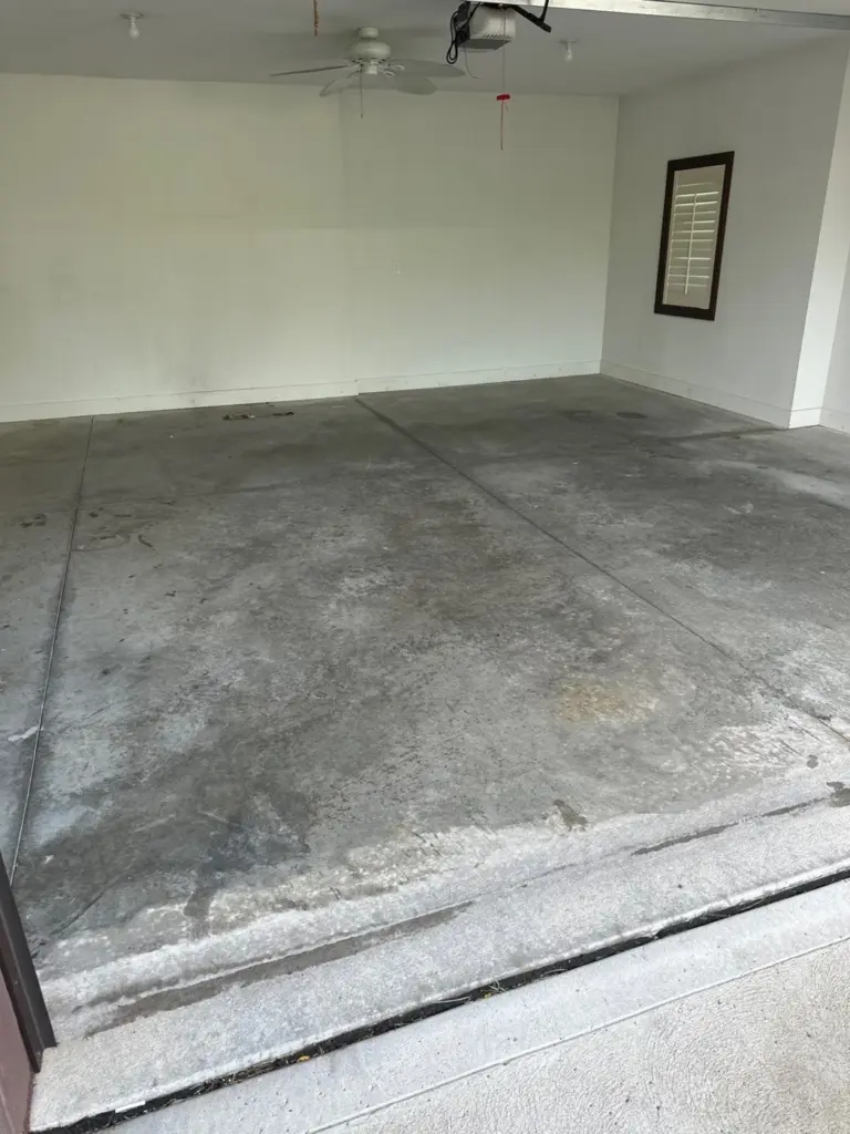 Before the project: IronRock flake coating on a garage floor