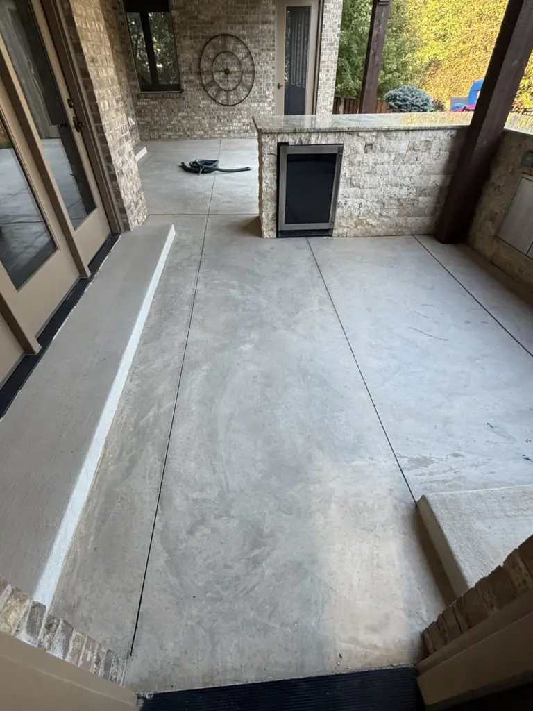 Before the project: IronRock flake coating on exterior concrete